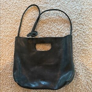 Distressed Black Leather Hana BAG by ABLE. 13” wide, 11” tall.